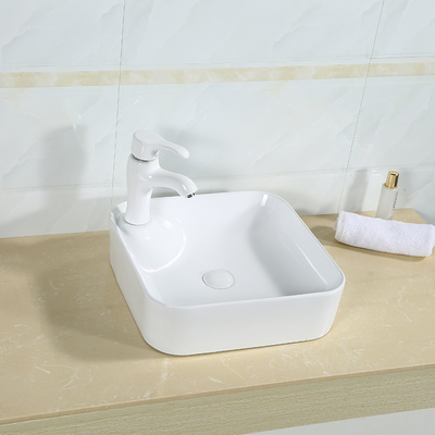 無孔のカウンター トップの浴室の流しの滑らかな表面の正方形の白い洗面器