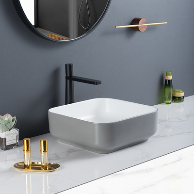 無孔の表面のカウンター トップの浴室の流しの対称の正方形の洗面器